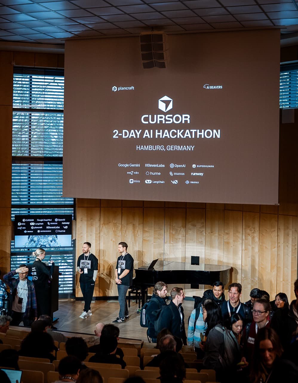 The opening session of the AI BEAVERS January 2026 hackathon in Hamburg, with the event title on a large screen