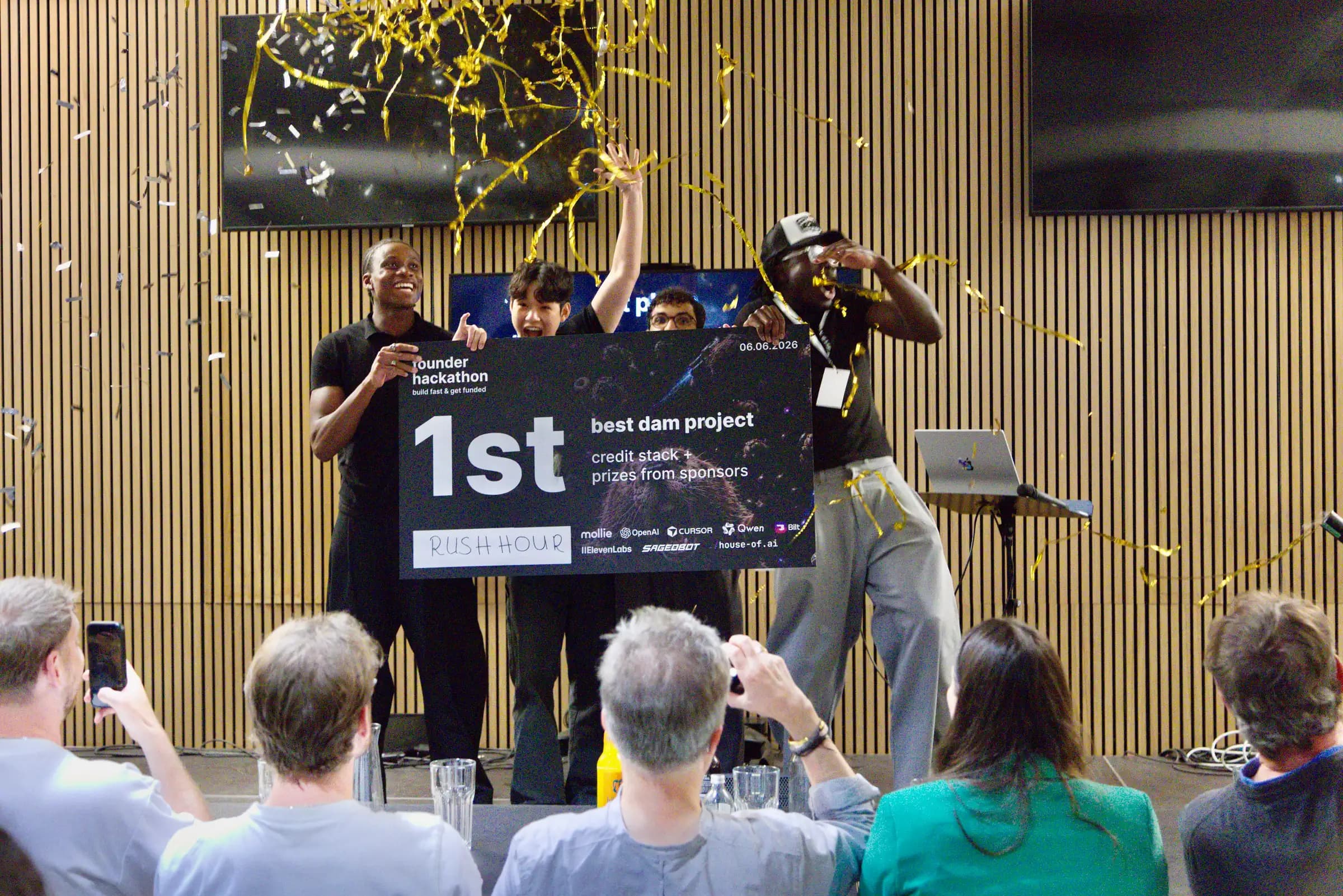 The winning team celebrating under falling confetti at the AI BEAVERS Founder Hackathon in Hamburg