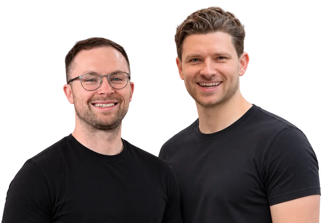 Alexander Zakharov and Vladyslav Nyzhashchyy, the Keystone instructors, smiling against a black background